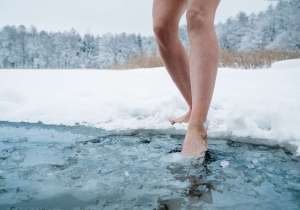 Woman stepping on cold water